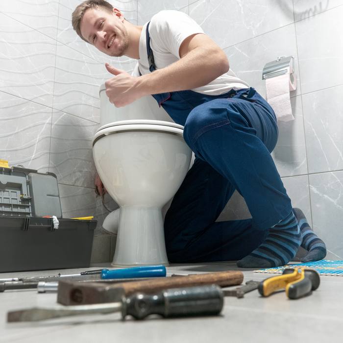 Happy FlowFix plumber
